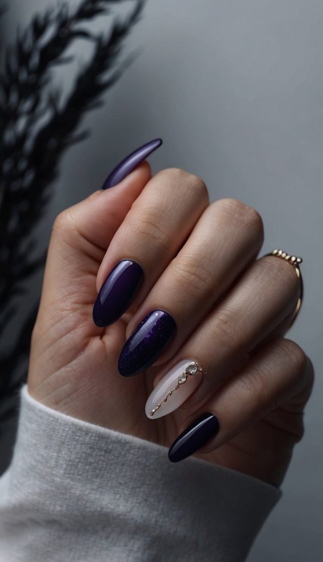 A dark, mysterious setting with blackberry wisp accents and moody lighting, showcasing the deep hues of the wedding nail designs