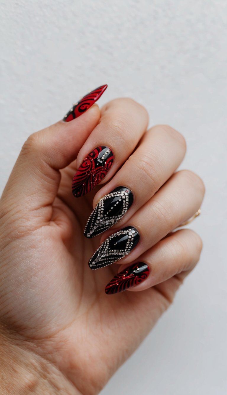 Almond-shaped manicure displayed on a softly curled hand, showcasing red and black wedding nails with rhinestone-lined black nails and crimson designs finished in elegant black filigree swirls.