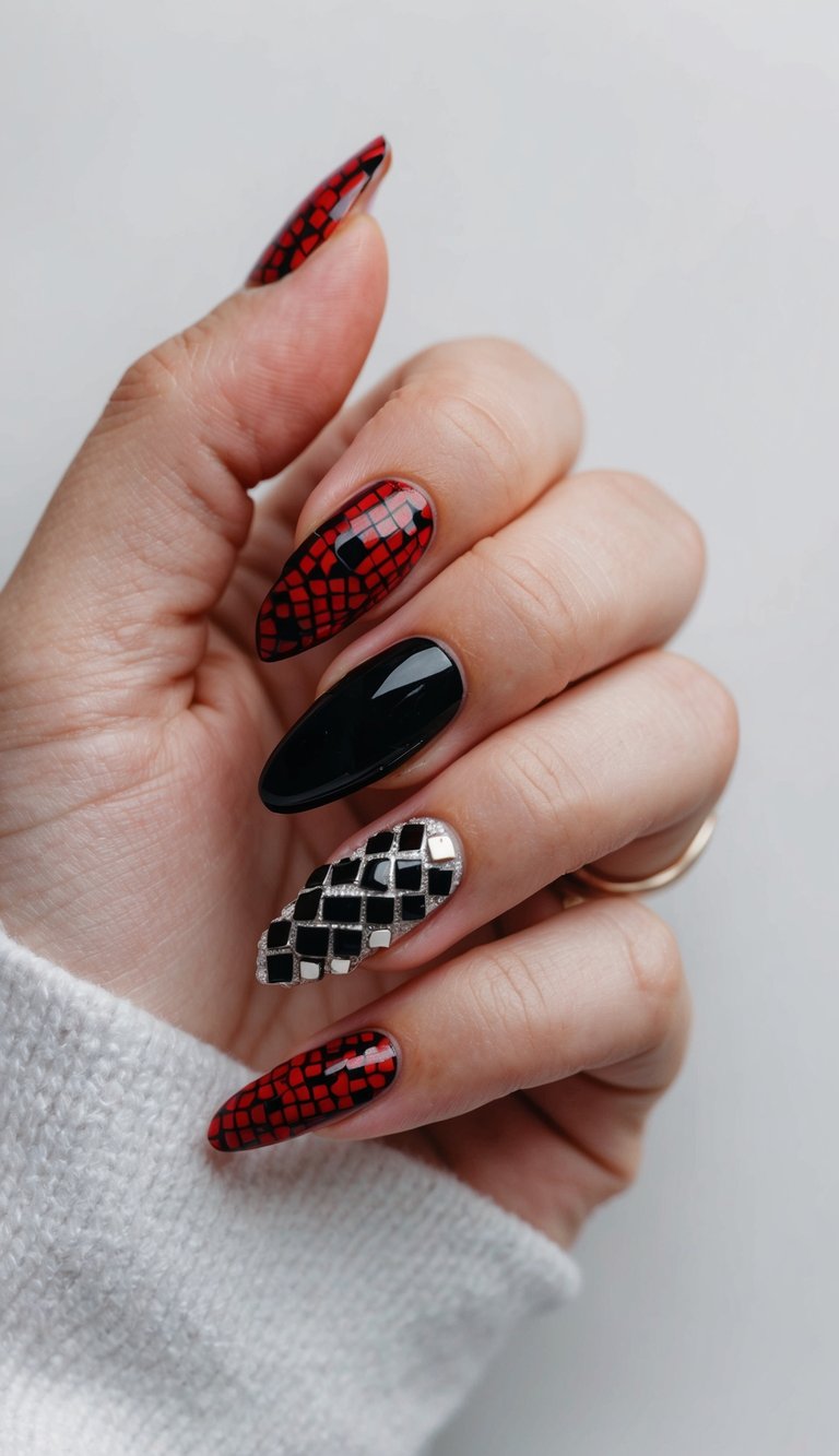 Manicured hand featuring red and black wedding nails, including red scale-inspired designs, a glossy black almond nail, and a metallic silver grid accent on one finger.